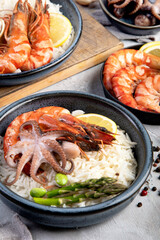 Shrimps with rice on light gray background.