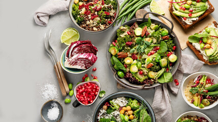 Vegan dishes assortment on gray background.