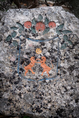 polychrome Sóller heraldic shield  carved on a rock, Camí dels Alous, Soller, Mallorca, Balearic Islands, Spain