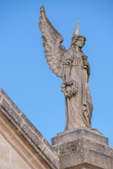 Fototapeta na wymiar angels of the main portal, Llucmajor cemetery, Mallorca, Balearic Islands, Spain