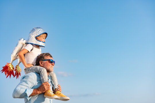 Grandfather and boy having fun outdoor