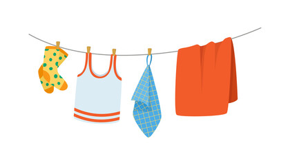 Drying children's clothes and accessories after washing on a rope.