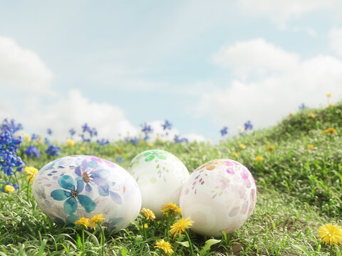 Three Easter eggs placed in the fresh spring grass