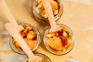 top view. convenient portioned serving of salads in small jars. beautiful original table setting for banquet. Catering. 