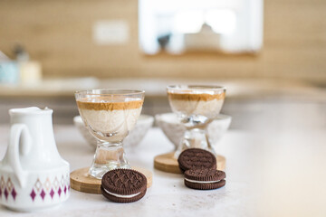 Dalgona coffee in glass close up, new Korean trend for whipped coffee