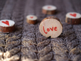 words of love and heart on wooden saw cuts