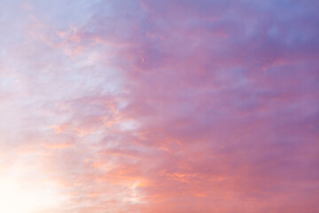 Naklejka na ściany i meble Colorful pink clouds in the sky at sunrise or sunset. Natural natural background.