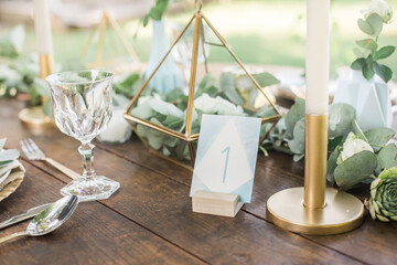 bohemian blue wedding table number on a wooden table, eucalyptus and gold decoration, watercolor...