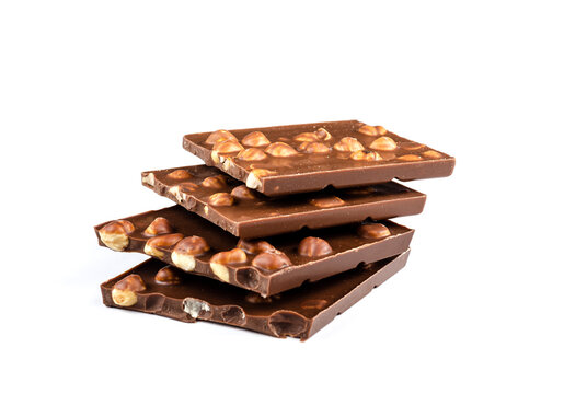 A stack of pieces of milk chocolate with a nut