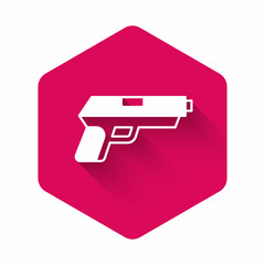 White Pistol or gun icon isolated with long shadow background. Police or military handgun. Small firearm. Pink hexagon button. Vector