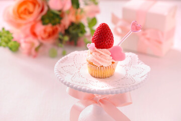Valentine cupcake with white chocolate and strawberry cream with strawberry 
Valentine bouquet of rose flowers  and gift.