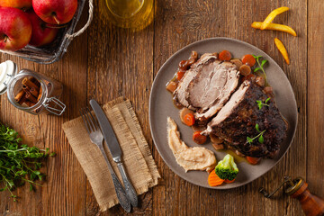 Whole roasted pork neck, stewed in wine with vegetables.