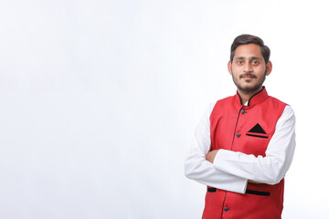 Young indian farmer in traditional wear and giving expression on white background.