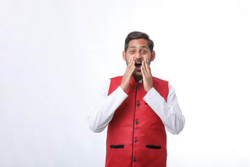 Young indian farmer in traditional wear and giving expression on white background.