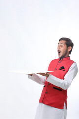 Young indian farmer in traditional wear and giving expression on white background.