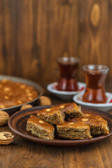 Baklava on the table and tea in Turkish glasses. Selective focus.