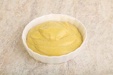 Organic mustard sauce in the bowl