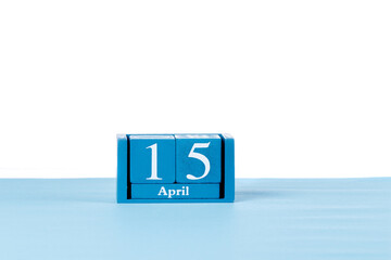 Wooden calendar April 15 on a white background
