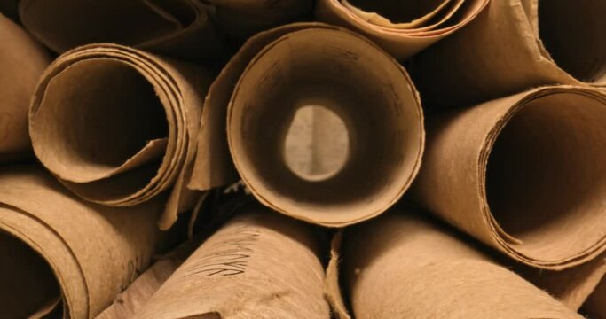 Old scribe library. Retro scrolls stacked on a pile.