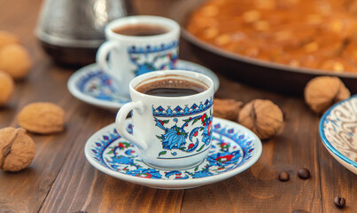 Baklava on the table and Turkish coffee. Selective focus.