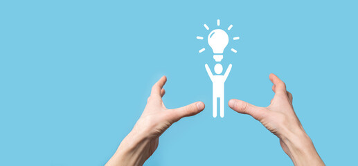 Businessman hold man icon with light bulbs, ideas of new ideas with innovative technology and creativity. concept creativity with bulbs that shine glitter.