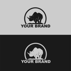 Rhinoceros standing vector logo silhouette isolated on white background 