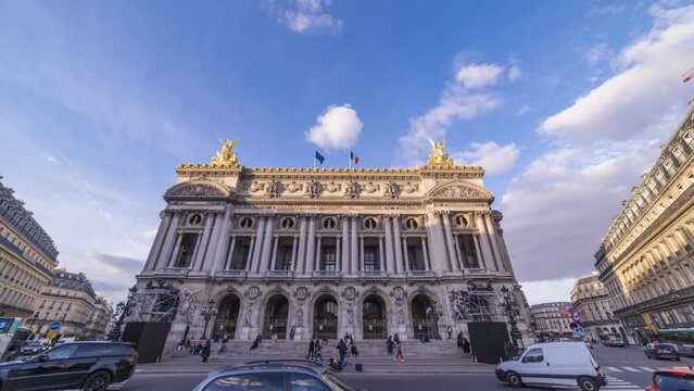 day to night time lapse of opera garnier building with blue lights