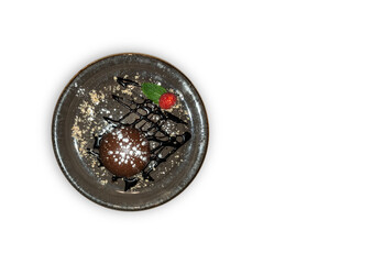 chocolate coulant with a strawberry - white background.