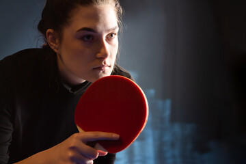 Young girl plays table tennis