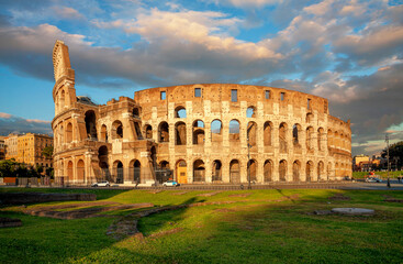 Fototapeta na wymiar Colosseum in the evening in Rome, Italy. Colosseum is one of the main attractions of Rome. Rome architecture and landmark.