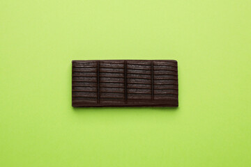 Hematogen bar on green background, top view