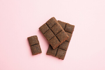 Delicious and healthy hematogen on pink background, flat lay