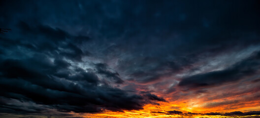 Dramatic sunset scene of the dark overcast sky. Fantastic view of stormy sky.