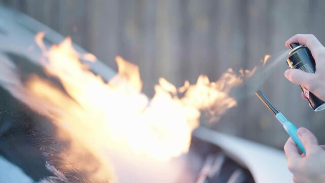 Defrosting windshield ice with flammable deodorant fire spray 4K