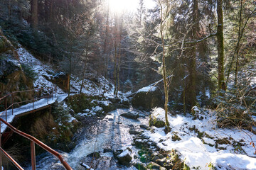 famous ravenna gorge, ravenna waterfall and wild river in the black forest in winter in breitnau...