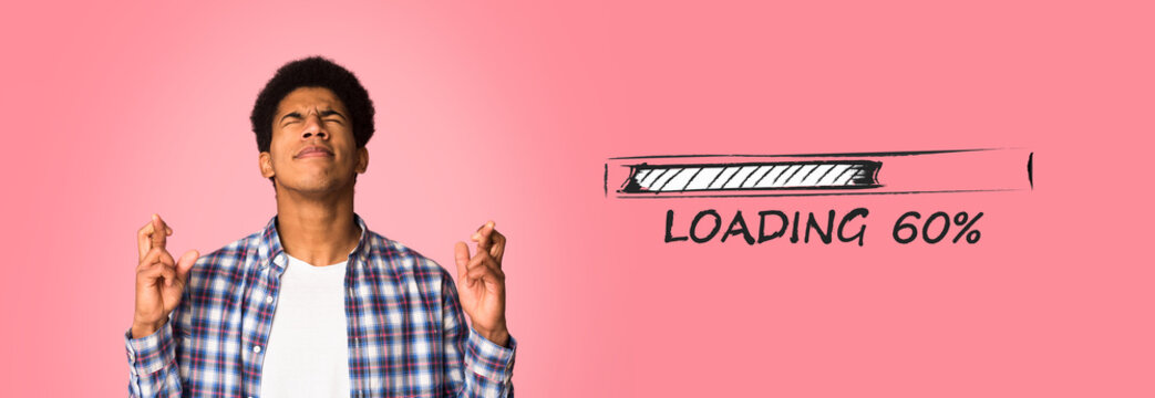 Young black guy crossing fingers, making wish with closed eyes on pink background, collage with loading progress bar - Powered by Adobe