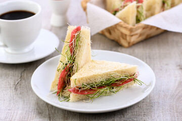 Wheat toast sandwich  with cream cheese with microgreen onion sprouts and salami. Healthy and fresh food.
