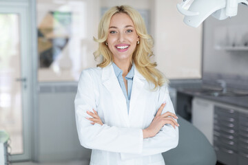 Cheerful beautiful woman doctor posing at newest dental clinic