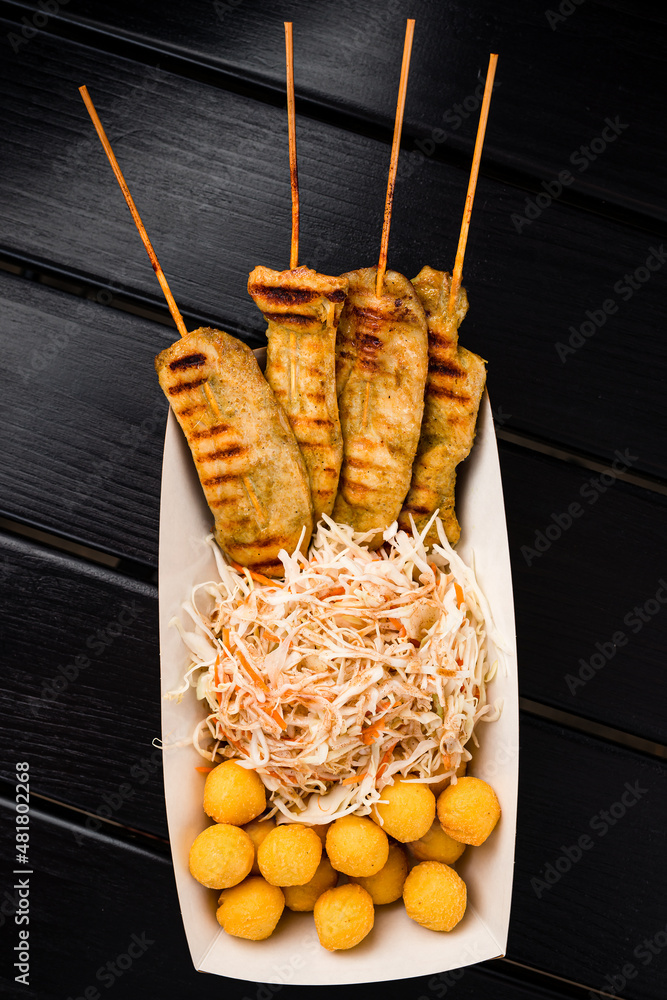 Poster kebab and deep-fried potato balls