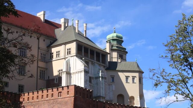 Cracow, Malopolska/Poland - 04.10.2020: Wawel, the royal castle. Kurza Stopa (Chicken`s Foot) tower and windows and balconies of royal private chambers.