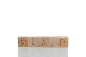 Wooden cubes with letters plain on a white background