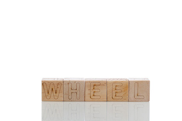 Wooden cubes with letters wheel on a white background
