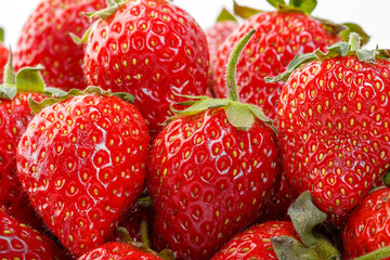 beautiful and ripe red strawberries on a white background