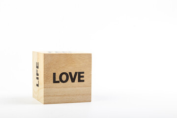 Wooden cubes with the inscription love on a white background