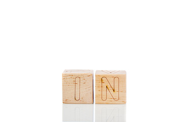 Wooden cubes with letters in on a white background