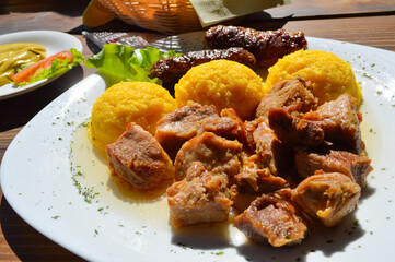 pork stew with polenta. traditional food. organic food.