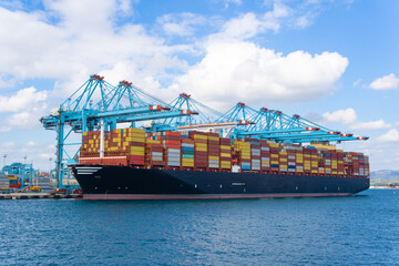 Container ship at industrial port in import export business logistic and transportation of...