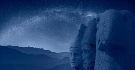 Statues on top of the Nemrut Mountain milkyway galaxy in the background - Adiyaman, Turkey