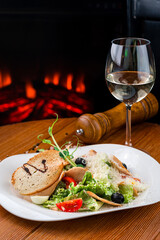Salad with cherry tomatoes, ham, croutons, lettuce, grated cheese