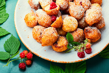 Curd donuts with raspberries